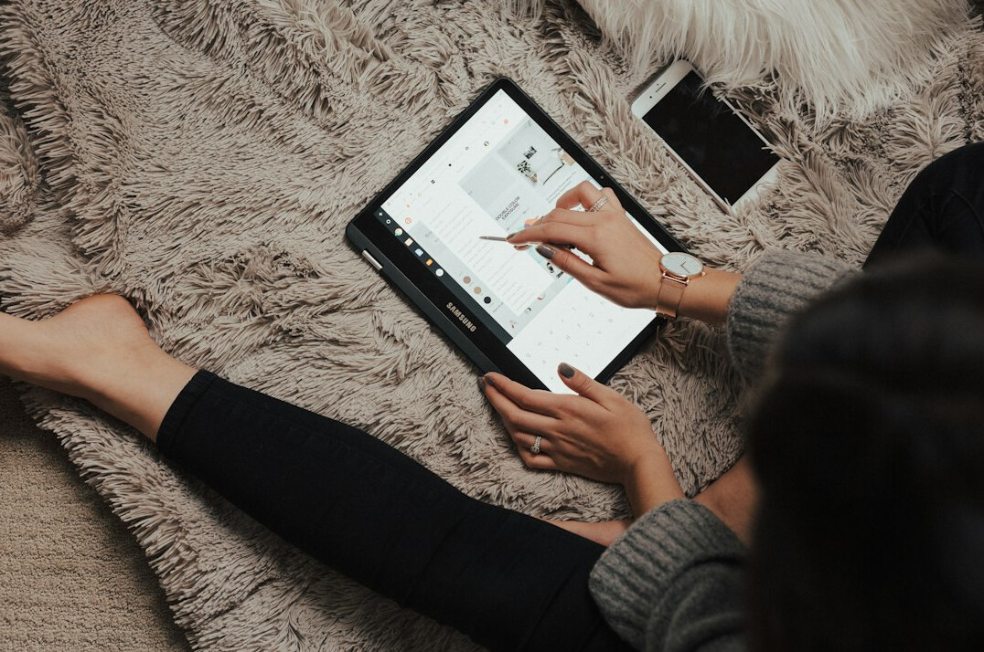 person reading ebook on tablet
