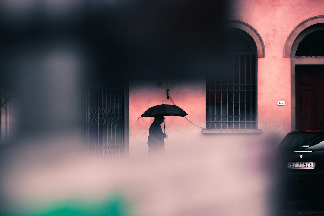 shadowy detective in rain